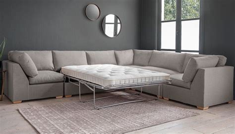 Create your perfect space with this large modular corner sofa bed. The two seater unit opens ...