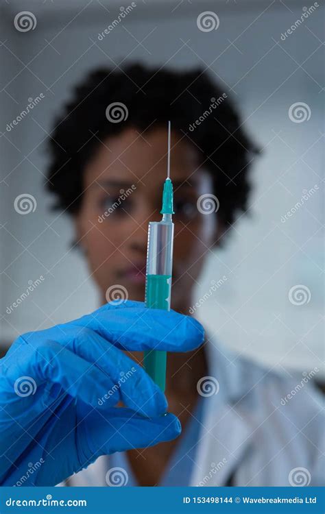 Female Doctor Holding Syringe with Needle at the Hospital Stock Photo ...