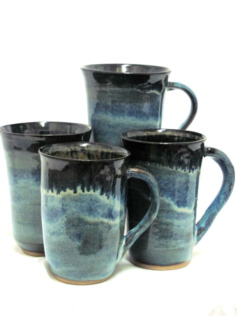 Wheel thrown stoneware coffee mugs glazed with Potters Choice Blue Rutile glaze and fired to ...