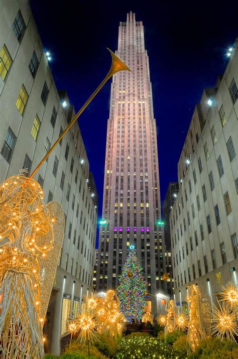 the rockefeller christmas tree is lit up in new york city's financial ...