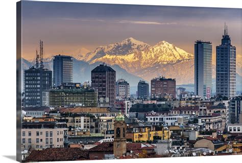 City skyline at sunset with the snowy Alps in the background, Milan ...