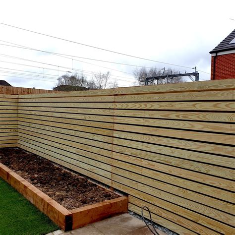 How to build a slatted fence | Wood fence design, Patio garden design, Brick fence