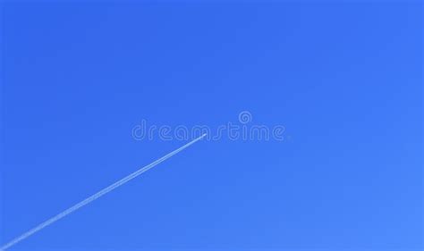 Flying plane in blue sky stock image. Image of blue, line - 25893683