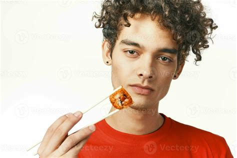 guy in red t-shirt fast food diet food snack light background 23758691 Stock Photo at Vecteezy