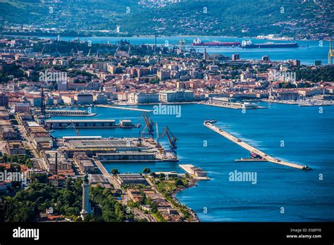 Trieste, Italy - A view of the city, the old port,the lighthouse and the Gulf of Trieste seen ...