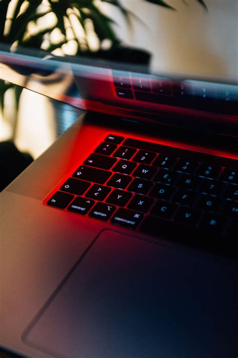 Picture of Laptop Keyboard In Red Hue — Free Stock Photo