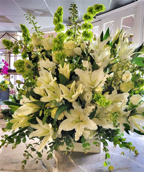 Beautiful side/floor arrangement array of white flowers in Pasadena, CA | Duran's Flowers