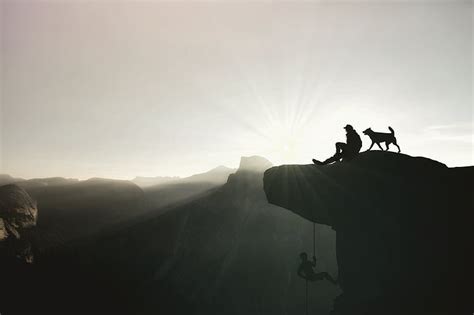 Royalty-Free photo: Man and dog on top of mountain | PickPik