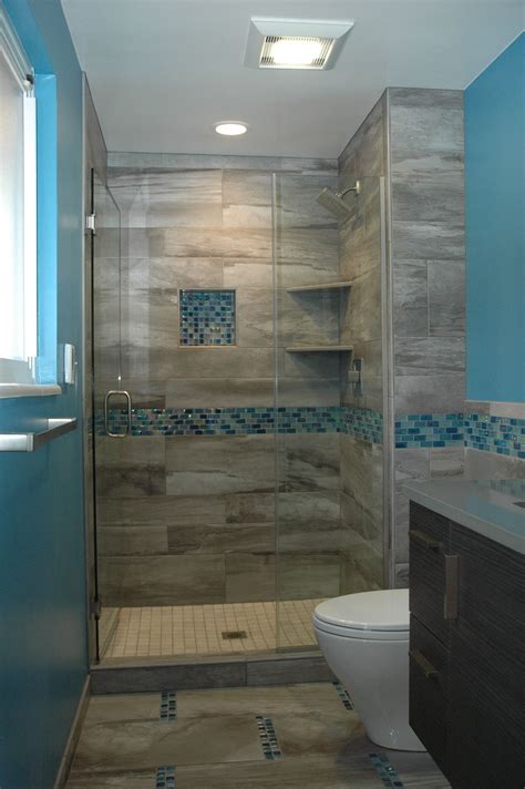 The blue accent tile makes this small bathroom pop with style ...