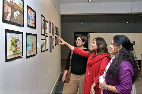 Students of National College of Arts viewing the displayed artwork ...