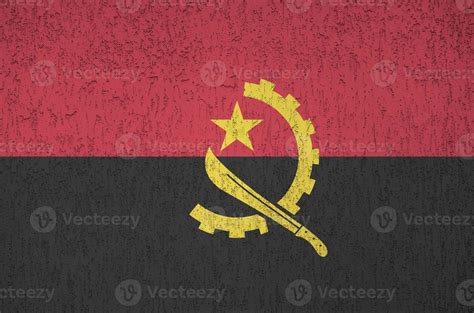 Angola flag depicted in bright paint colors on old relief plastering ...