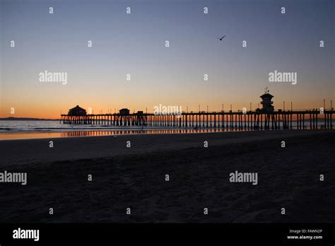 Huntington Beach pier at sunset Stock Photo - Alamy