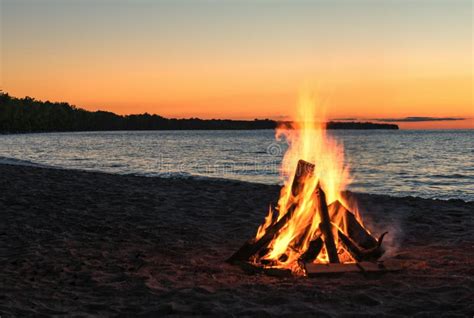 Beach Bonfire at Sunset stock image. Image of evening - 78938733