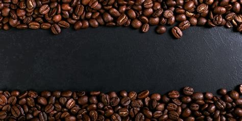 Premium Photo | Aroma roasted coffee beans on rustic tabletop, brown banner background.
