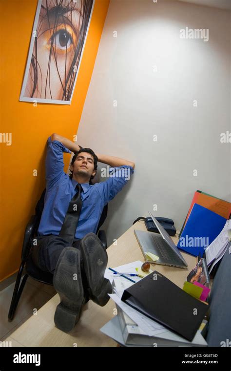 Man sleeping in the office Stock Photo - Alamy