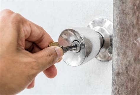 Unlocking Door with Key in Hand Stock Photo - Image of keyhole, lock: 42748514