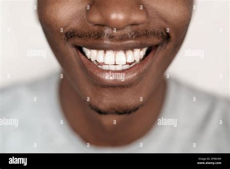 Closeup of a young African man with a big smile Stock Photo - Alamy