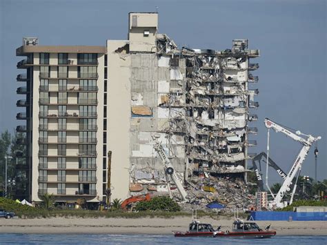 A Miami building is evacuated near the site of the deadly Surfside ...