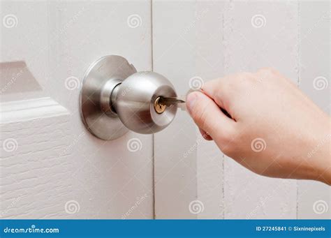 Hand Opening Door By Key Stock Image - Image: 27245841