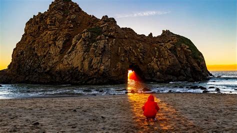 See Big Sur's fiery keyhole arch before it's gone