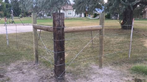 How to install a H brace corner for barb wire fence - YouTube