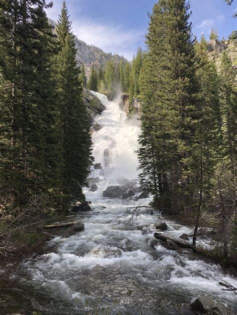 Epic view of Hidden Falls. Beautiful stop along the Jenny Lake loop hike. Grand Tetons National ...