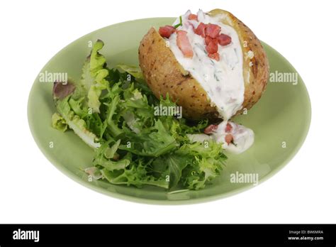 Jacket Potato with Bacon Bits and Sour Cream Stock Photo - Alamy