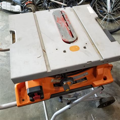 RIDGID TABLE SAW ON FOLDING ROLLING STAND