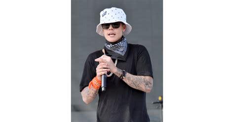 Justin Bieber wore a bucket hat, a black bandanna, and sunglasses | Celebrities Wearing Masks at ...