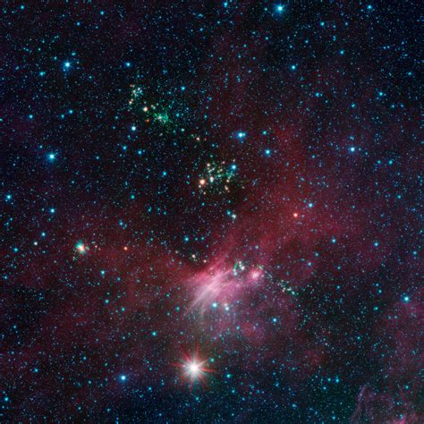 Spitzer Views Birth and Death of Stars at the Outer Edges of the Galaxy