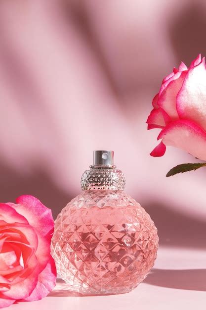 Premium Photo | Perfume bottle and rose flowers Concept of expensive ...