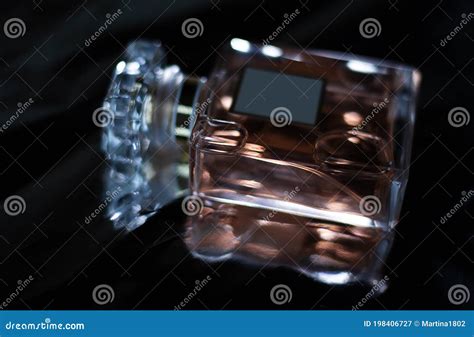 Perfume on dark background stock image. Image of container - 198406727