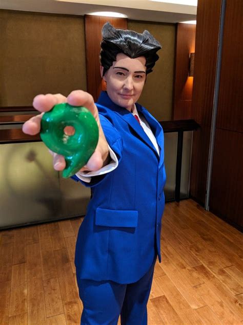 Phoenix Wright cosplay with his magatama from the Ace Attorney series ...