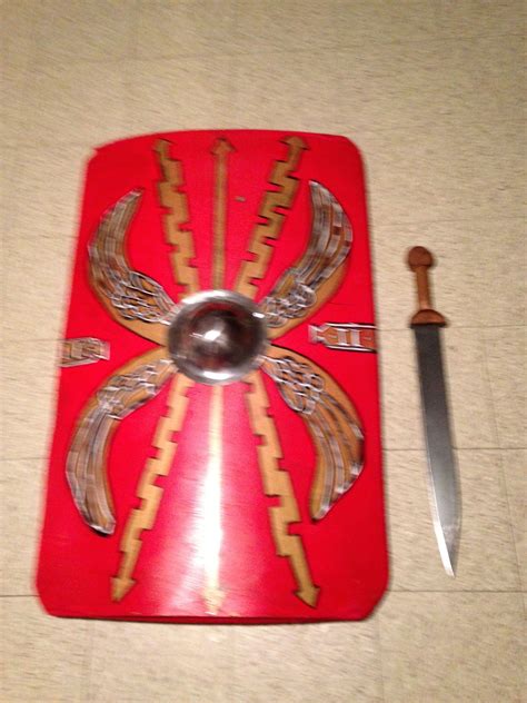 Roman scutum shield and gladius sword. The shield is made of 3 layers of 1/4" plywood, bended ...