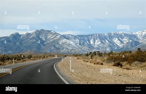 Scenic winding road leading up to a mountain Stock Photo - Alamy