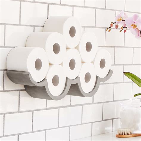 This cloud-shaped wall sculpture is filled in with rolls of toilet paper. | Toilet paper storage ...