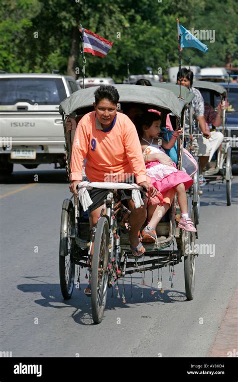 Visitors ride in bicycle rickshaw Ayutthaya Thailand Stock Photo - Alamy