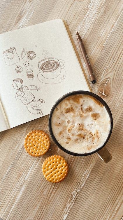 Coffee, Cookies and Drawings in Notebook · Free Stock Photo