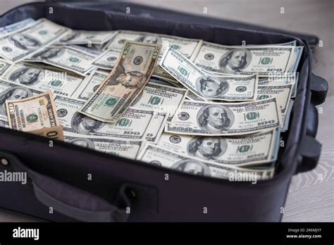 Open suitcase with one million dollars bills stacks Stock Photo - Alamy