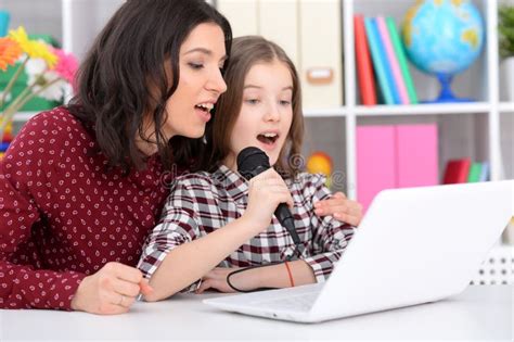 Close Up Portrait of Mother and Daughter Singing Karaoke Stock Image - Image of daughter, color ...