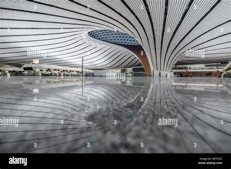 The Beijing Daxing International Airport is illuminated by light projections at night in Beijing ...