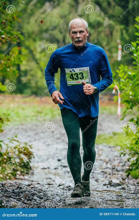 Old man running uphill editorial stock image. Image of masters - 58971149