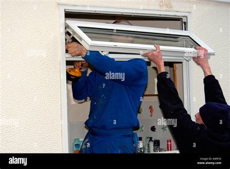 UPVC Window Installation on a mobile home by professional fitters Stock Photo - Alamy