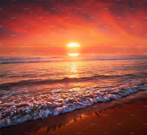 beautiful red sunset on beach | Nature Stock Photos ~ Creative Market