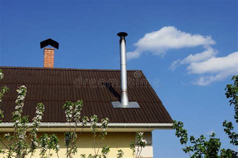 Gray Metal Chimney Pipe on a Brown Slate Roof Stock Image - Image of ...