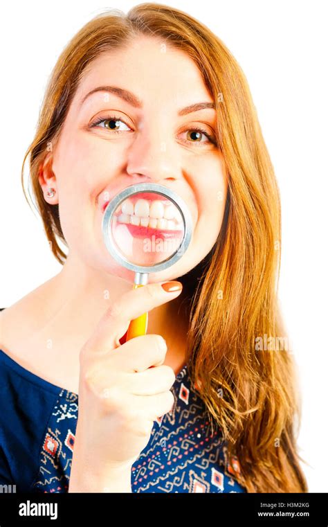 girl with magnifier showing his beautiful white teeth Stock Photo - Alamy