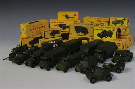 A collection of Dinky Toys army vehicles and field guns, comprising a No. 621 3-ton army wagon, two