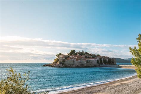 "Island Of Sveti Stefan At Sunset Beside A Beautiful Beach, Montenegro" by Stocksy Contributor ...