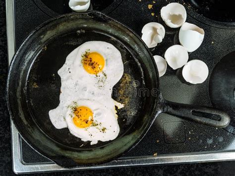 Frying Eggs in a Cast Iron Pan Stock Photo - Image of food, cooking: 72216410