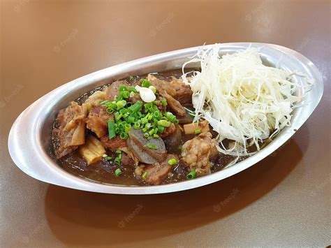 Premium Photo | Beef tendon curry rice bowl